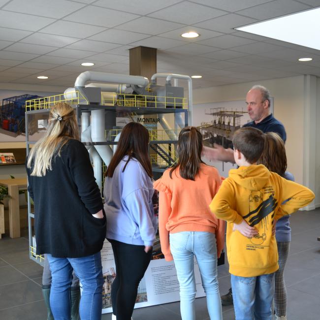 Stefan Bouten shows a scale model during Youth Business Day